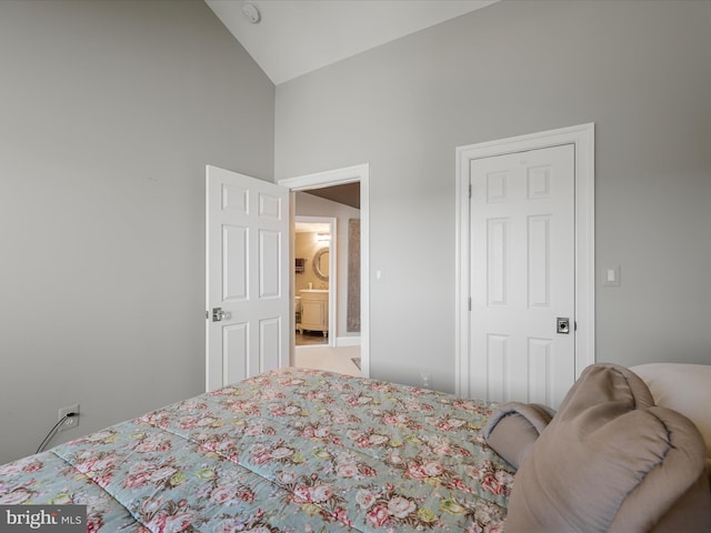 carpeted bedroom with vaulted ceiling