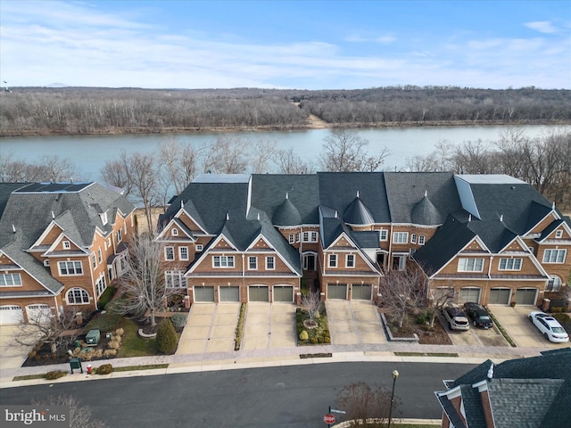 birds eye view of property featuring a residential view and a water view