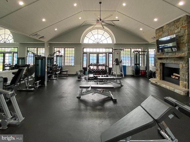 workout area with a ceiling fan, visible vents, high vaulted ceiling, recessed lighting, and a fireplace