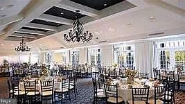 dining room featuring beamed ceiling, a notable chandelier, and coffered ceiling