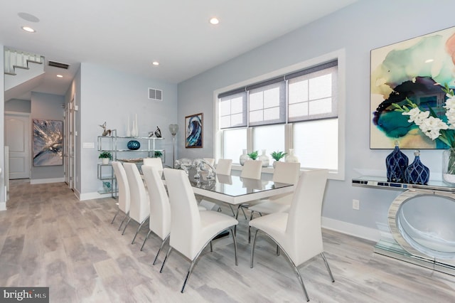 dining room with light hardwood / wood-style flooring