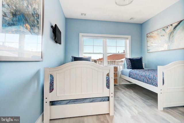 bedroom featuring light hardwood / wood-style floors