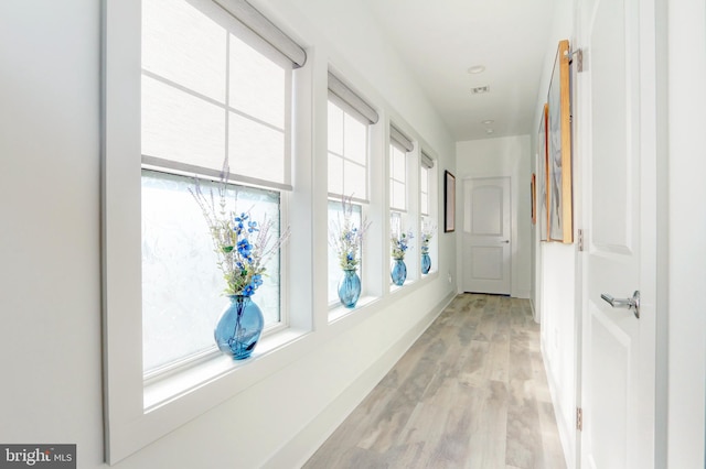 corridor featuring light hardwood / wood-style flooring