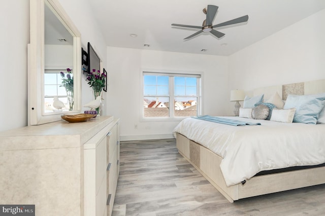 bedroom featuring light hardwood / wood-style flooring and ceiling fan