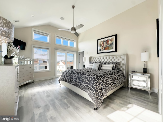 bedroom with ceiling fan, access to outside, high vaulted ceiling, and wood-type flooring