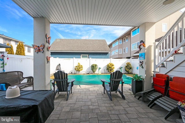 view of patio featuring a covered pool