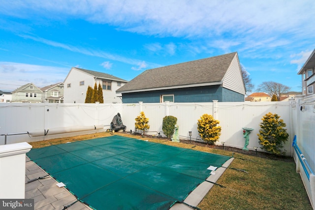 view of pool featuring a yard and a patio area