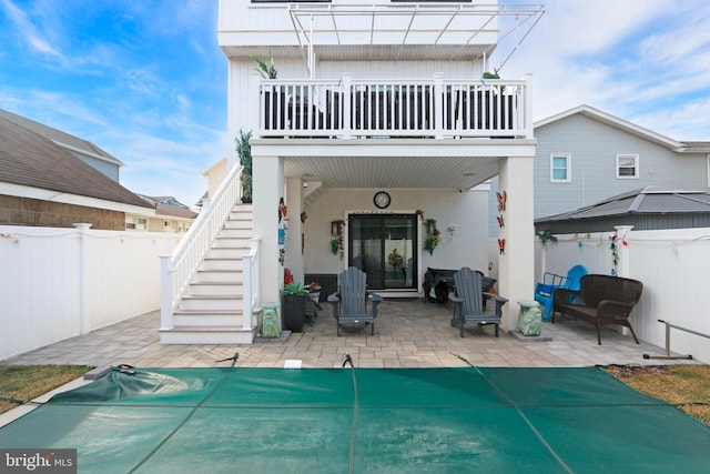 back of house with a patio