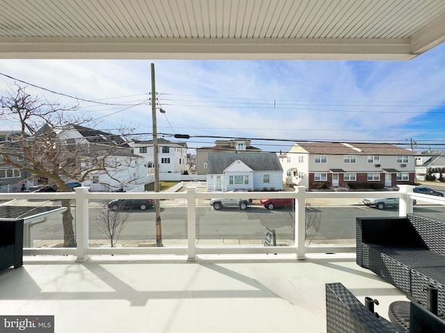 view of patio featuring a balcony