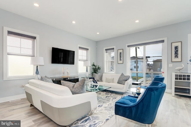 living room with light hardwood / wood-style floors