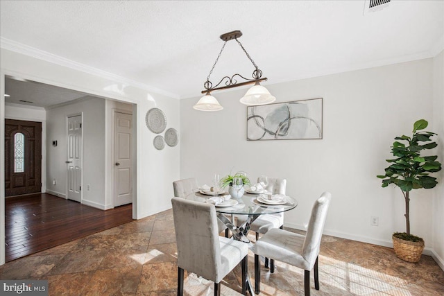 dining room with crown molding