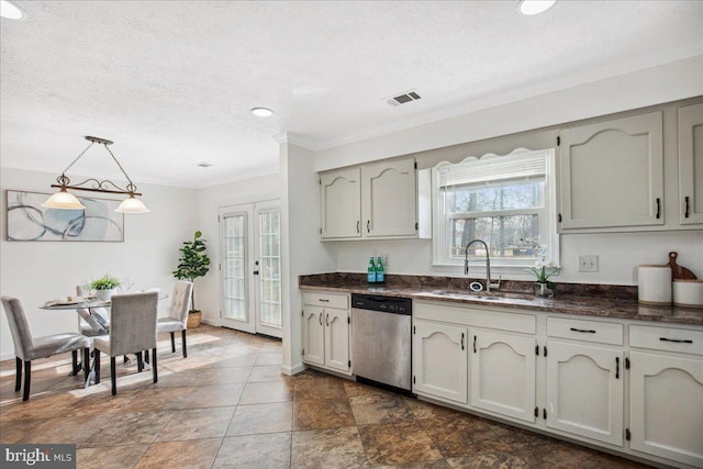 kitchen with a wealth of natural light, sink, stainless steel dishwasher, and decorative light fixtures