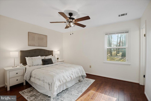 bedroom featuring ceiling fan and dark hardwood / wood-style flooring