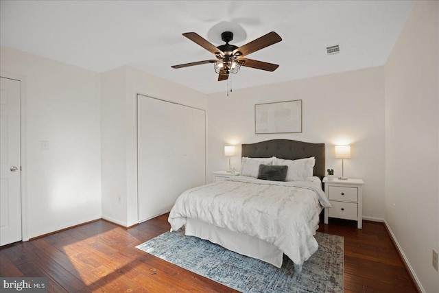 bedroom with ceiling fan and dark hardwood / wood-style flooring