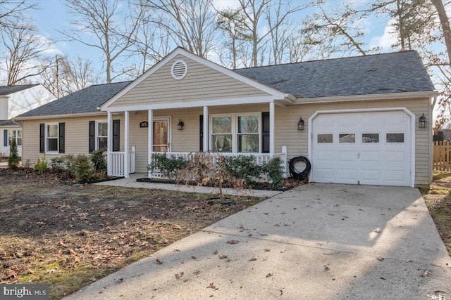 single story home with a garage and covered porch