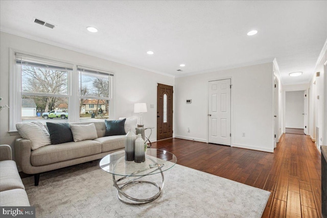 living room featuring ornamental molding and dark hardwood / wood-style floors