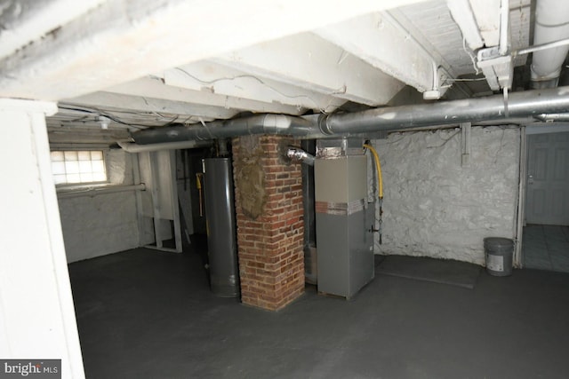 basement featuring heating unit and water heater