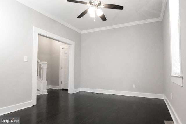 spare room featuring crown molding, ceiling fan, and dark hardwood / wood-style flooring