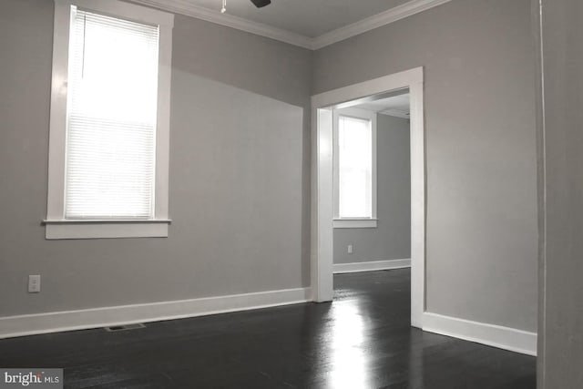 unfurnished room with ceiling fan, ornamental molding, and dark hardwood / wood-style floors