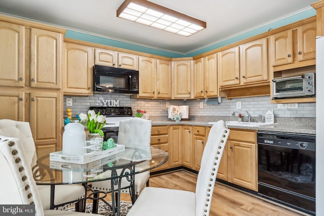 kitchen featuring sink, light hardwood / wood-style flooring, backsplash, black appliances, and light brown cabinets