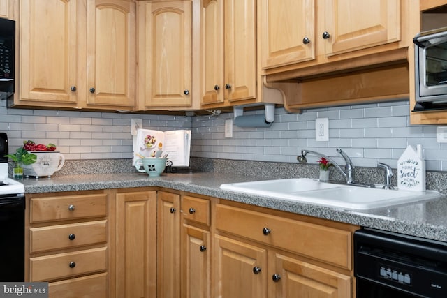 kitchen with tasteful backsplash, sink, and black appliances