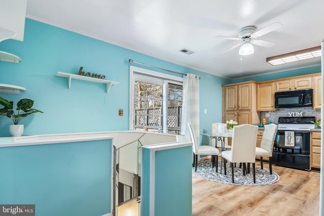 kitchen featuring crown molding, backsplash, electric range, light hardwood / wood-style floors, and light brown cabinets