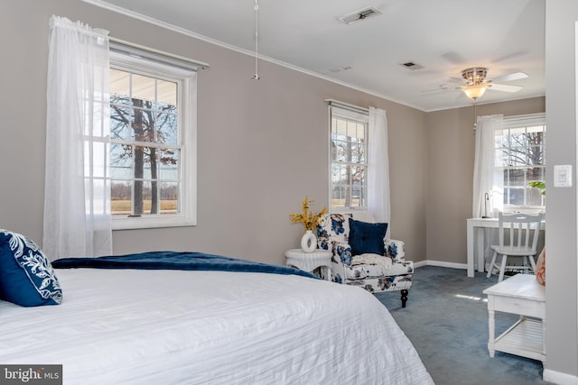 carpeted bedroom featuring crown molding and ceiling fan