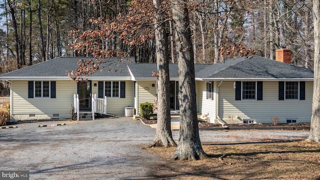 ranch-style house featuring cooling unit