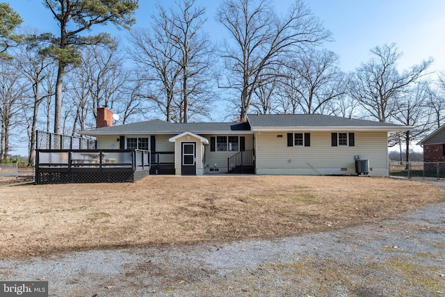 single story home with central AC, a front yard, and a deck