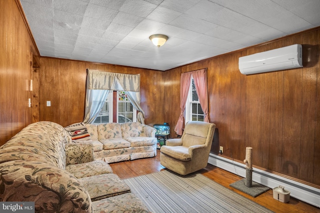 living room featuring baseboard heating, wood-type flooring, a wall unit AC, and wood walls