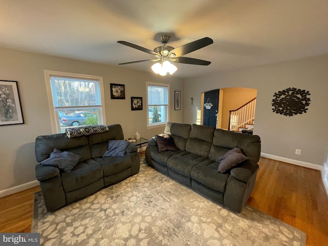 living room with hardwood / wood-style flooring and ceiling fan