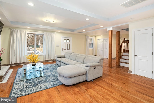 1034 Excelsior Dr, Upper Chichester, PA 19014 - living room featuring a raised ceiling and light wood-type flooring