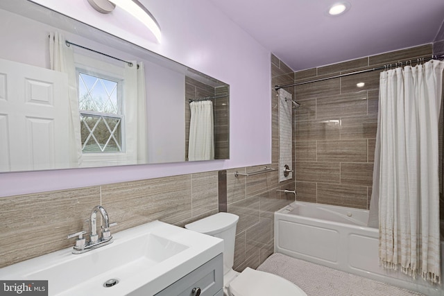 1034 Excelsior Dr, Upper Chichester, PA 19014 - full bathroom with vanity, toilet, tile walls, and shower / bath combo