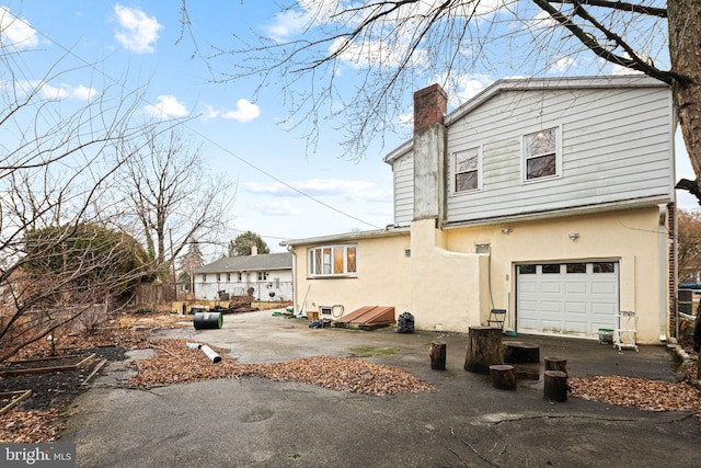 1034 Excelsior Dr, Upper Chichester, PA 19014 - back of house with a garage