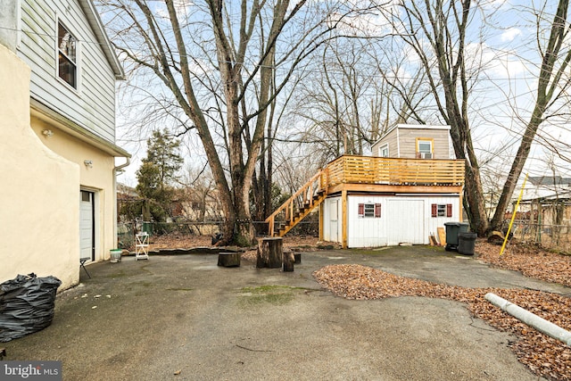 1034 Excelsior Dr, Upper Chichester, PA 19014 - exterior space with a wooden deck, a garage, and an outdoor structure