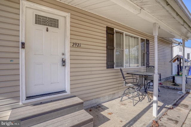 doorway to property featuring a porch