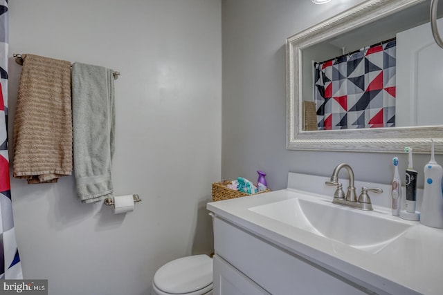 bathroom with vanity and toilet