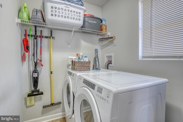 laundry area with washing machine and dryer