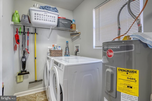 clothes washing area with separate washer and dryer, electric water heater, and light tile patterned floors