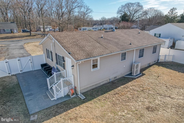 rear view of property with a yard