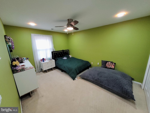 carpeted bedroom with ceiling fan