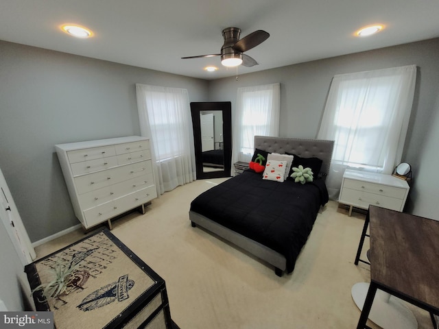 carpeted bedroom with ceiling fan