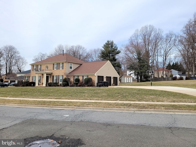 view of front facade with a front lawn and a garage