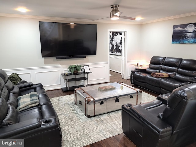 living room with ceiling fan, dark hardwood / wood-style flooring, and ornamental molding