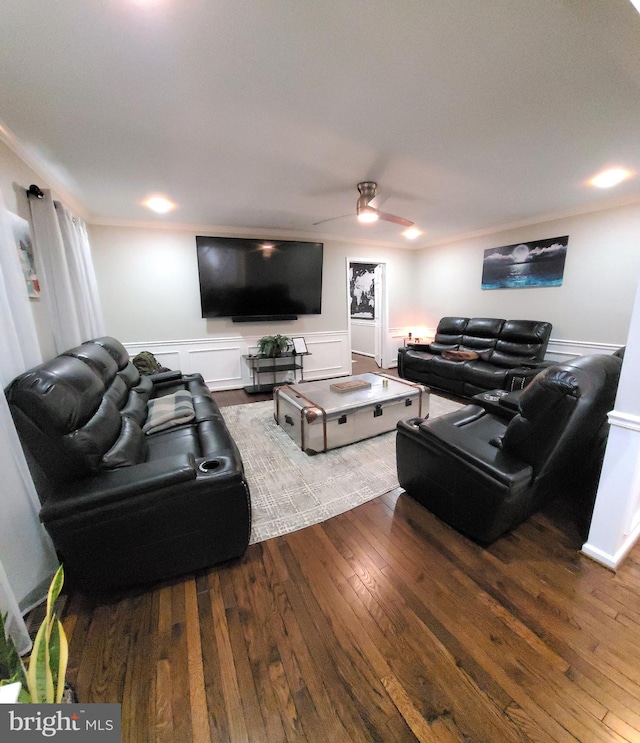 living room featuring crown molding, wood-type flooring, and ceiling fan