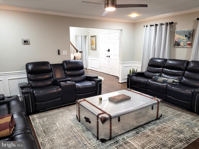 living room featuring ornamental molding, hardwood / wood-style floors, and ceiling fan