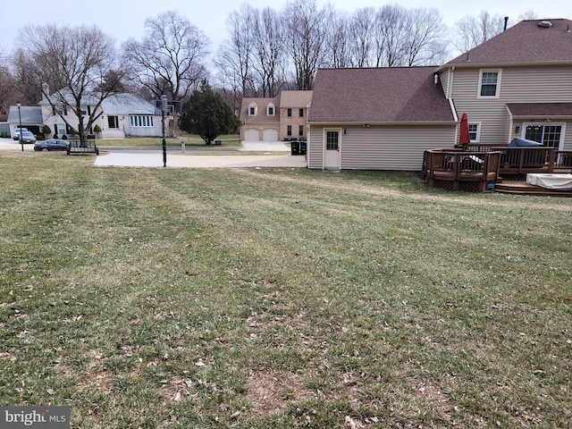 view of yard featuring a wooden deck