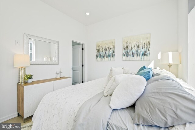 bedroom with hardwood / wood-style floors