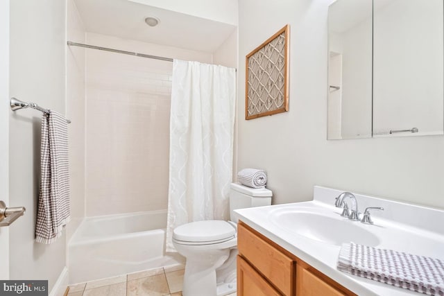 full bathroom featuring vanity, toilet, tile patterned flooring, and shower / tub combo