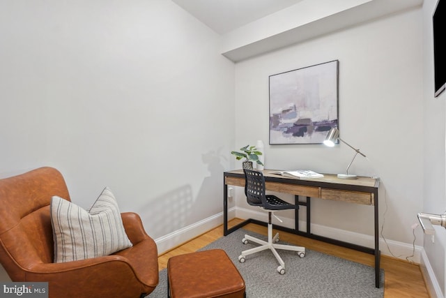 office space with light hardwood / wood-style flooring